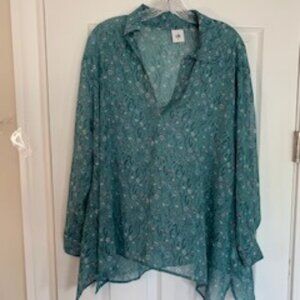 Sheer cabi top with floral design.